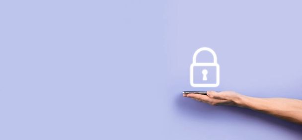 Male hand holding a lock padlock icon.Cyber security network. Internet technology networking.Protecting data personal information on tablet. Data protection privacy concept. GDPR. EU.Banner. - Φωτογραφία, εικόνα