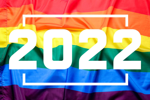 Bandera LGBT, primer plano. Feliz Año Nuevo 2022 celebración - Foto, imagen