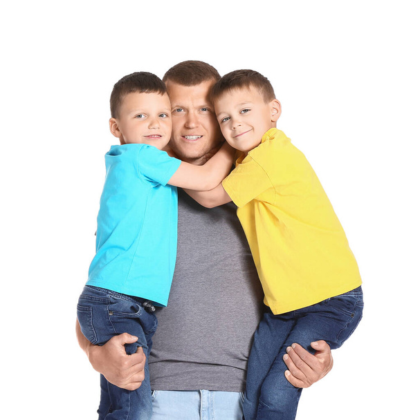Portrait of father with little children isolated on white - Photo, Image