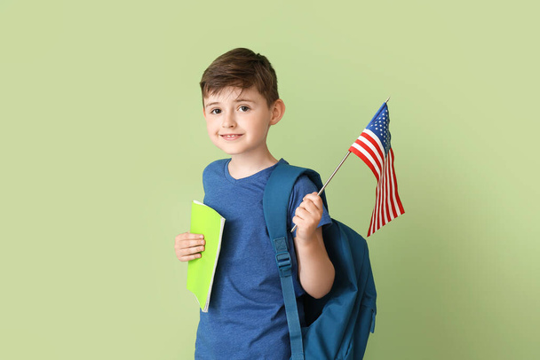Pupil of language school with USA flag on color background - Photo, Image