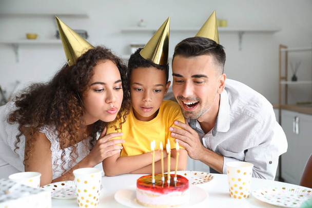 Happy interracial family celebrating birthday at home - Fotografie, Obrázek