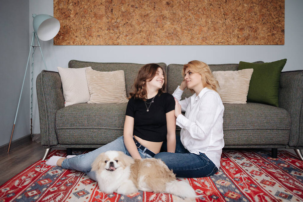 Mother, daughter and adorable dog - Photo, Image