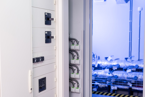switchboard in equipment room of modern data center, cyber security concept - Photo, Image