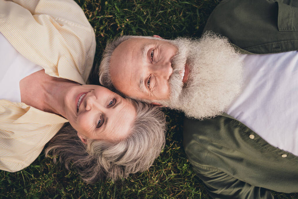 Top above high angle view photo of old people man woman harmony lie grass nature weekend outdoors outside in park - Foto, imagen