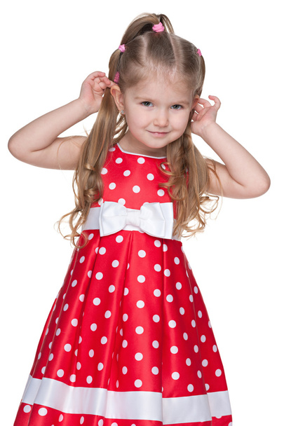 Adorable little girl in the polka dot dress - 写真・画像