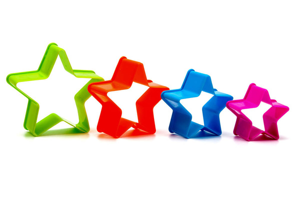 Set of colored shapes in the form of stars for Christmas cookies on a white background. Isolated. - Фото, зображення