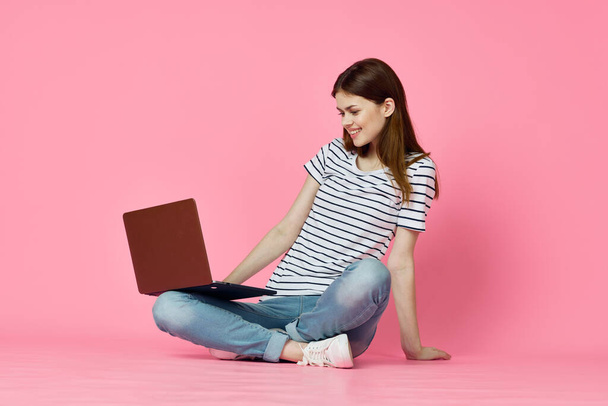 woman with laptop on pink background online shopping entertainment - Foto, Imagen