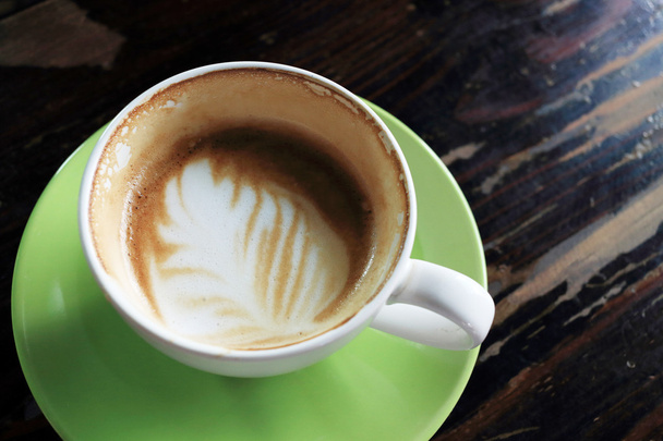 coffee cup on wooden table - Фото, зображення