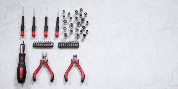 Universal screwdriver set with replaceable bits on a light background. - Photo, Image