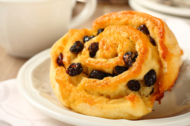 Fresh gluten free sweet swirl bun with raisins - Photo, Image