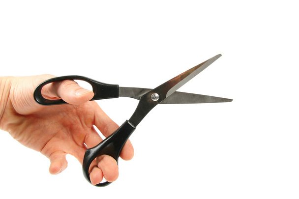 Scissors in hand isolated on white - Fotografie, Obrázek