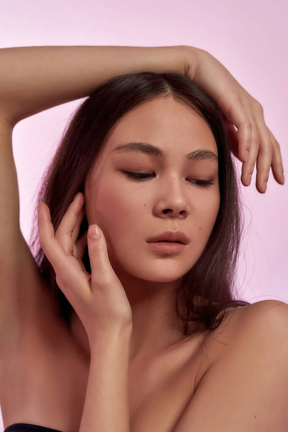 Beautiful sexy Asian woman with flawless glowing skin - Photo, image