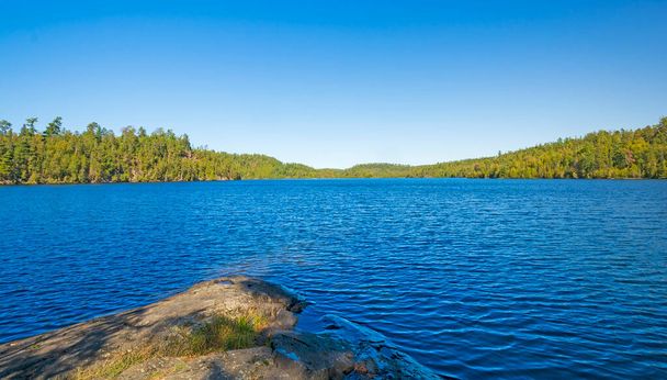 Blue Skies and Water in the Evening Light on Ottertrack Lake in the Boundary Waters in Minnesota - Fotografie, Obrázek