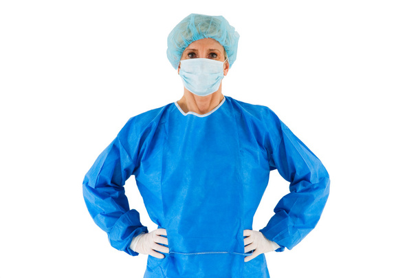 Female surgeon standing with coat - Φωτογραφία, εικόνα