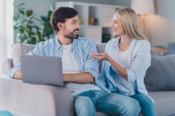 Photo of free-time married couple conversation film discussion wear casual outfit in comfortable home indoors - Φωτογραφία, εικόνα