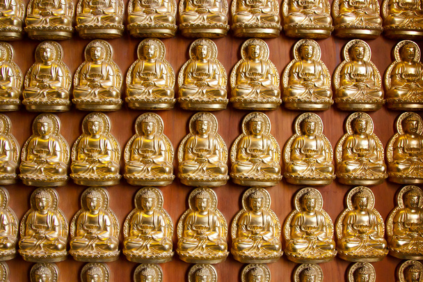 Piccole statue buddha come sfondo
 - Foto, immagini