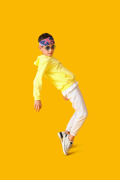 Dancing little boy on color background - Photo, Image