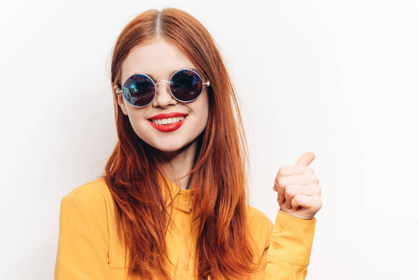 cheerful attractive woman in yellow shirt fashionable clothes sunglasses - Foto, Imagem