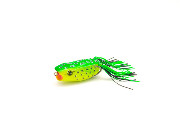 Side view close-up topwater frog lure bait isolated on white background. Surface poppers frog shape and realistic decoration features frog belly with chines for freshwater bass fishing double hooks - Photo, Image