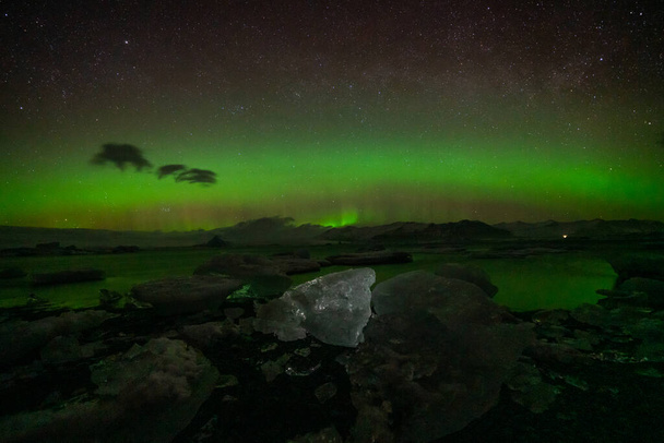 Incredible Aurora Borealis activity above the coast in Iceland - Photo, Image