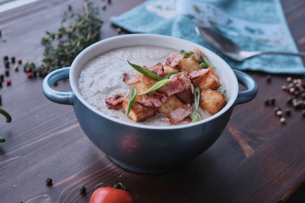Cream soup with bacon and croutons decorated on wood - Φωτογραφία, εικόνα
