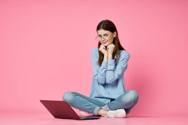 woman with laptop on pink background online shopping entertainment - Valokuva, kuva