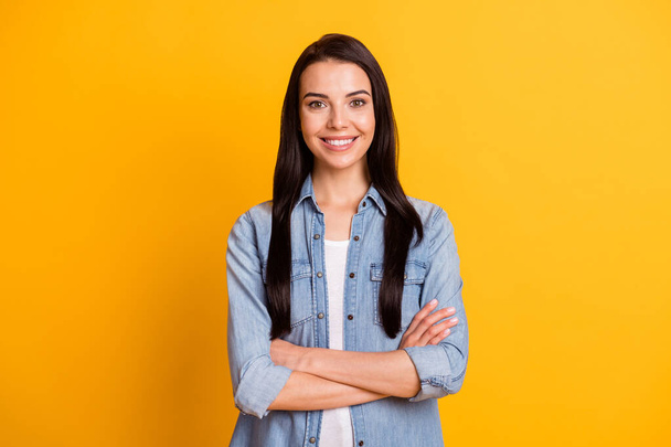 Portrait of nice optimistic brunette lady crossed arms wear blue shirt isolated on bright yellow color background - Foto, immagini