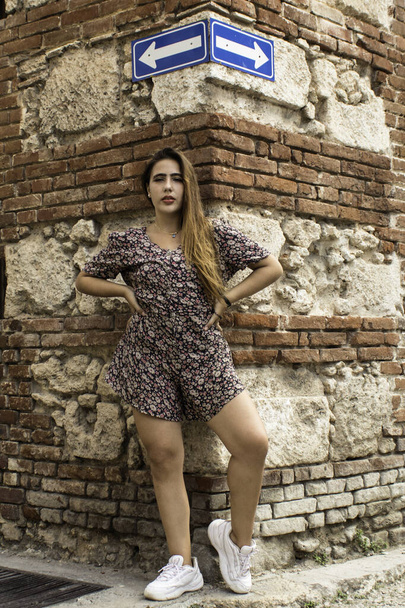 A vertical shot of a portrait of a young Caucasian female in Old Havana, Cuba - Photo, Image