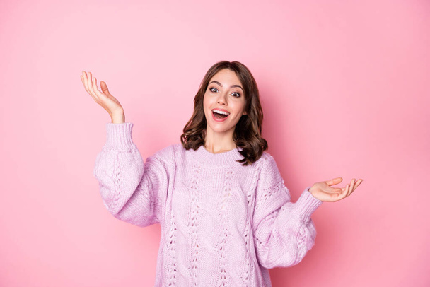 Photo of shiny charming young woman knitted sweater rising arms isolated pastel pink color background - Photo, image