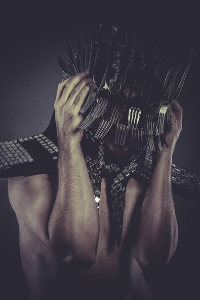 Man with helmet made of forks - Valokuva, kuva
