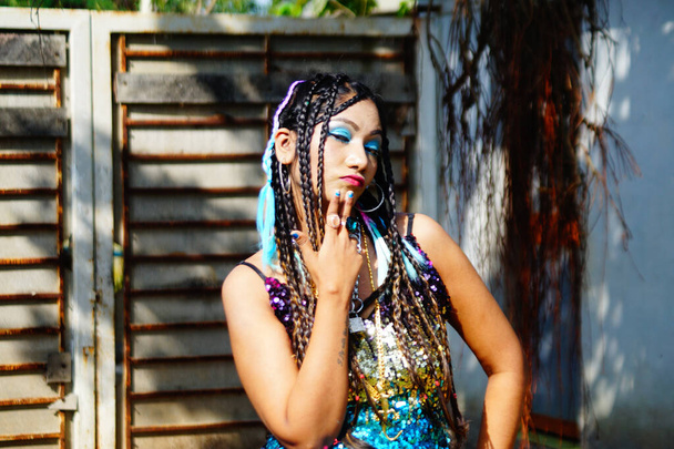 A stylish Indian female with dreadlocks posing at camera - Foto, imagen
