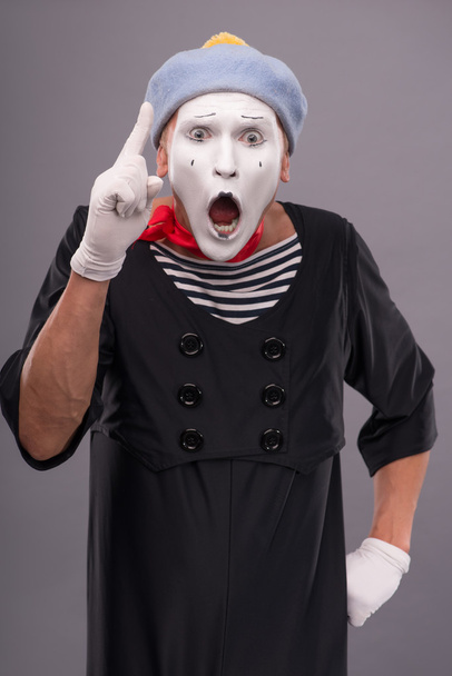 Male mime showing sign Attention with opened mouth - Fotografie, Obrázek