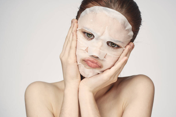 pretty woman naked shoulders face mask close-up skin care - 写真・画像