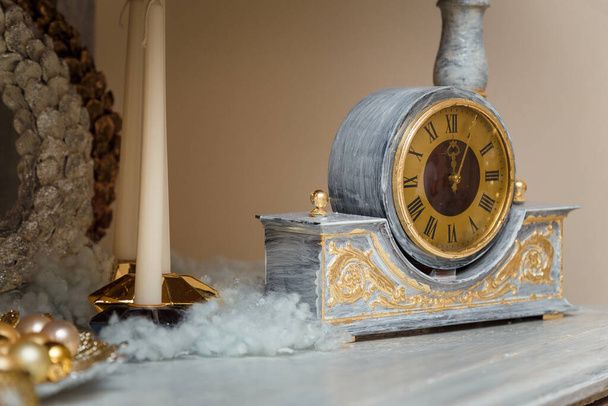Happy New Year, vintage clock with golden dial, minutes past midnight, artificial snow. Winter holidays decorative elements - Fotografie, Obrázek