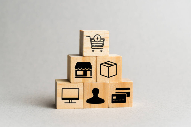 Concept add to cart. Abstract scheme on wooden cubes of work online orders. - 写真・画像