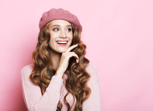 Profile side view portrait of her she nice-looking attractive lovely pretty cute winsome charming cheerful cheery content wavy-haired woman folded arms isolated over pink pastel color background - Zdjęcie, obraz