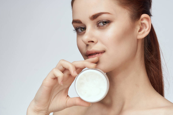 woman with jar of cream makeup face skin care close-up - Zdjęcie, obraz
