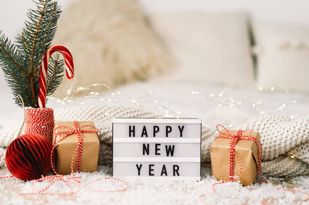 Happy New Year. New Year background with presents, garlands and New Year decorations. - Foto, Bild