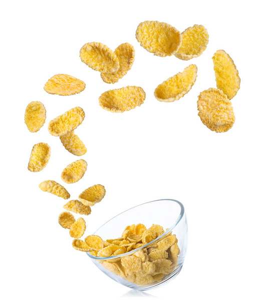 cornflakes in air falling into glass bowl - Photo, Image