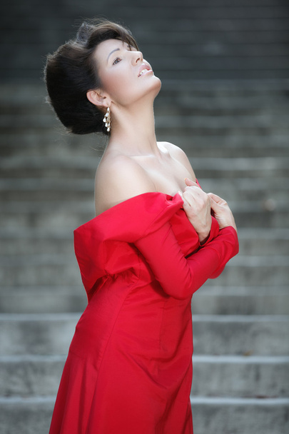 Beautiful fashionable woman in red dress - Fotoğraf, Görsel