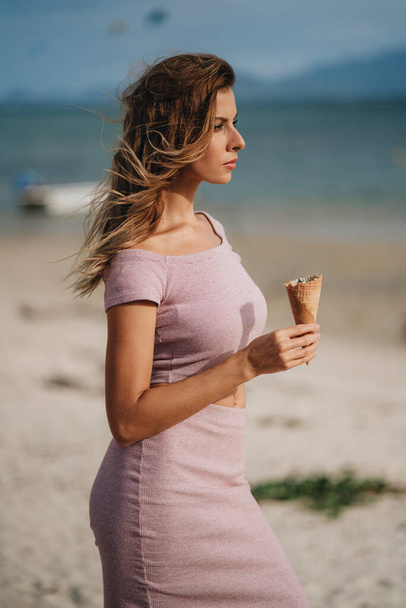 A portrait of caucasian blonde woman with ice cream - Zdjęcie, obraz