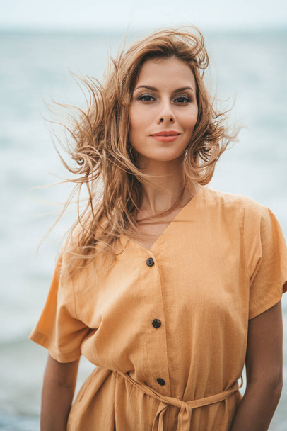 A portrait of caucasian blonde woman at the beach - Foto, Imagem