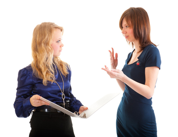 Дві молоді ділові жінки обговорюють документи
 - Фото, зображення