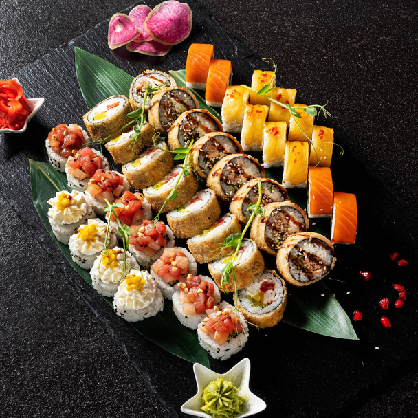 sushi on the black background - Фото, изображение