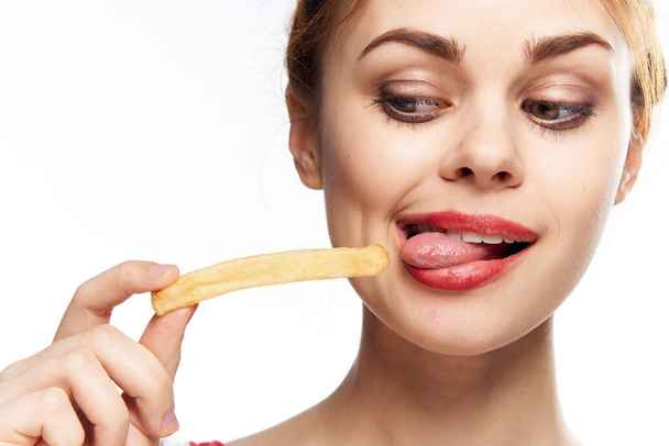 woman with fast food diet food snack light background - Zdjęcie, obraz