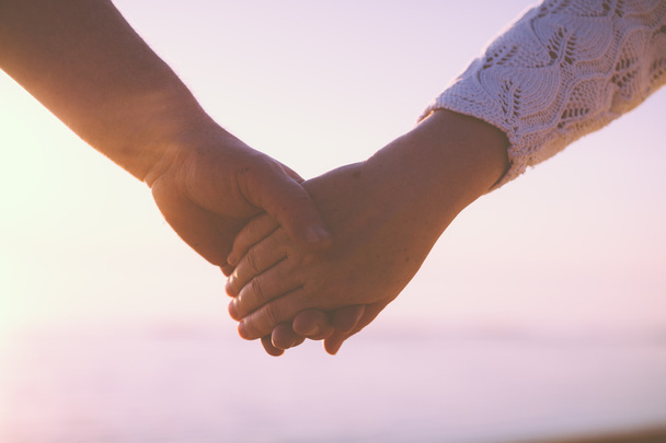 Senior couple holding hands - Photo, image