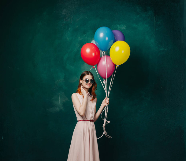 cheerful woman with colorful balloons holiday fun - Foto, imagen