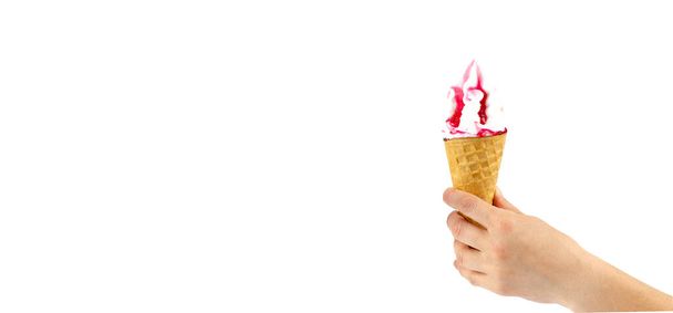 Multicolored ice cream cone in hand. Hand holds ice cream. On white background. - Fotó, kép