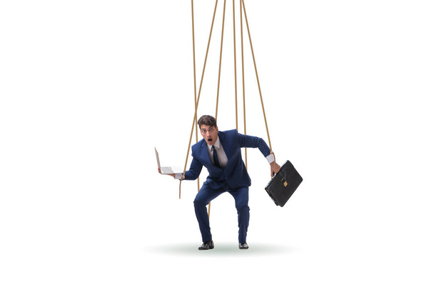 Businessman puppet being manipulated by ropes - Photo, Image