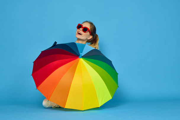 woman with multicolored umbrella in yellow sweater posing rainbow colors - Photo, Image